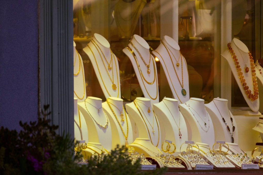 a row of white chairs sitting in front of a window